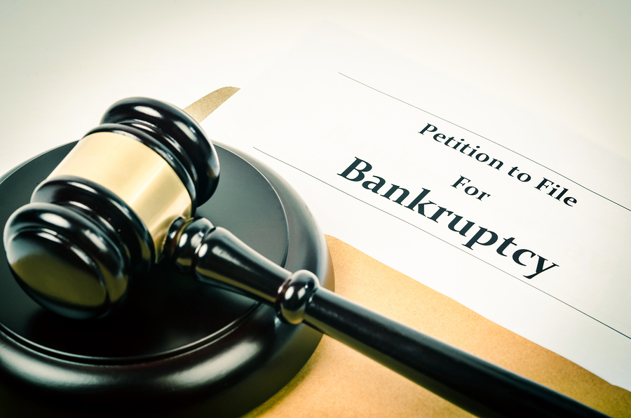 What To Expect Before During And After Filing For Bankruptcy   Bigstock Bankruptcy Document With Woode 225367279 